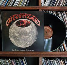 Load image into Gallery viewer, Glitter Wizard - Hollow Earth Tour vinyl record on a shelf with other records