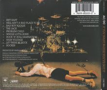 Load image into Gallery viewer, Back cover of an album with a person lying on the ground, a drum set, and tracklist.