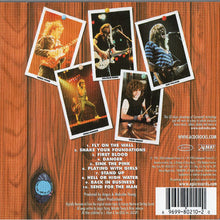 Load image into Gallery viewer, Back cover of a music album with photos of a band member and tracklist on a wooden background