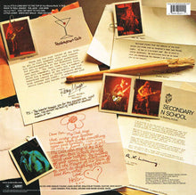 Cargar imagen en el visor de la galería, AC/DC - High voltage back album cover with handwritten letters, photos, and text on a wooden surface