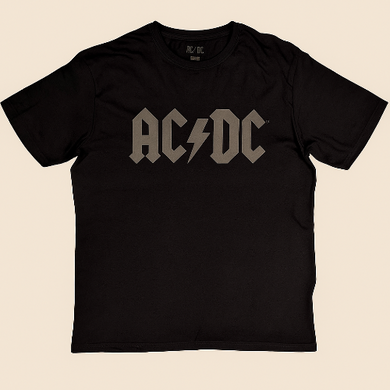 Black t-shirt with AC/DC logo on a beige background