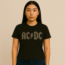 Charger l&#39;image dans la galerie, Person wearing a black AC/DC t-shirt against a beige background