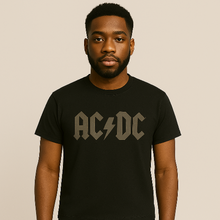 Charger l&#39;image dans la galerie, Person wearing a black AC/DC t-shirt against a beige background