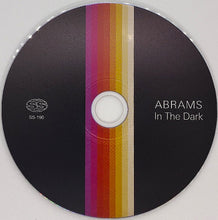 Load image into Gallery viewer, CD or DVD with a colorful striped design and text 'ABRAMS In The Dark' on a gray background