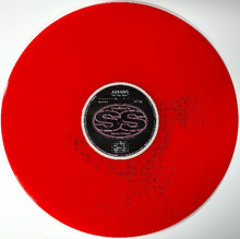 Charger l'image dans la galerie, Red vinyl record with a label on a white background