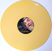 Cargar imagen en el visor de la galería, Vinyl record with a yellow outer sleeve and black label featuring a portrait.