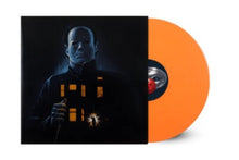 Load image into Gallery viewer, Vinyl record with orange sleeve featuring a character holding a house-shaped light bulb.
