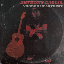 Load image into Gallery viewer, Anthony Gaglia sitting with a guitar in front of him, against a black background with a red and white label featuring the title 'VOODOO HEARTBEAT'.
