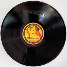 Load image into Gallery viewer, Vinyl record with a label on a white background