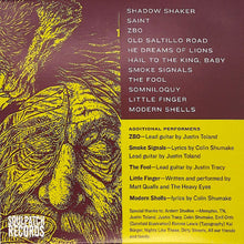 Load image into Gallery viewer, The Heavy Eyes - He Dreams Of Lions back album cover with text and artistic depiction of a figure on a purple and yellow background
