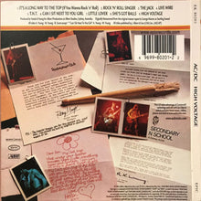 Load image into Gallery viewer, AC/DC - High Voltage back cover of an album with photos, text, and a cinnamon stick on a textured surface.