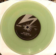 Load image into Gallery viewer, Vinyl record with a green disc and black label featuring 'Bad Brains' on a white surface.