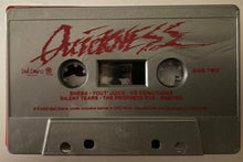 Charger l'image dans la galerie, Cassette tape with red text on a beige background