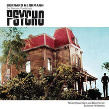 Charger l'image dans la galerie, A vinyl record cover featuring the movie Psycho's iconic house with a red roof, a tree, and a person standing in the foreground. The cover has text detailing the composer and the movie title.