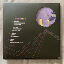 Charger l'image dans la galerie, Vinyl record cover with text and a circular design on a dark background