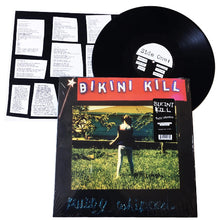 Load image into Gallery viewer, Vinyl record with 'Bikini Kill' album cover featuring a person in a field.