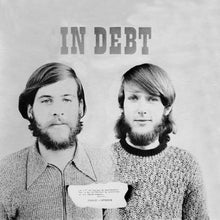Load image into Gallery viewer, Black and white photo of two men with text 'IN DEBT' above them.