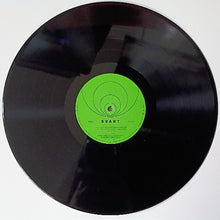 Cargar imagen en el visor de la galería, Black vinyl record with a green label on a white background