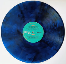 Cargar imagen en el visor de la galería, Blue vinyl record with a green label on a white background