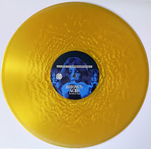Cargar imagen en el visor de la galería, Yellow vinyl record with a blue label featuring text and images on a white background