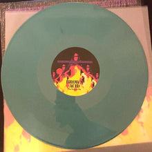 Charger l&#39;image dans la galerie, Green vinyl record with a colorful label featuring people and text on a pink background