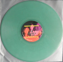 Load image into Gallery viewer, Green vinyl record with a label featuring two faces on a white background