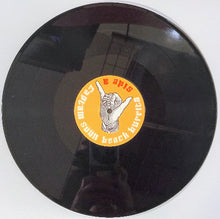 Cargar imagen en el visor de la galería, Vinyl record with a yellow label featuring a hand gesture on a white background