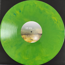 Cargar imagen en el visor de la galería, Green vinyl record with a label on a black background