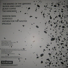 Cargar imagen en el visor de la galería, Album cover with text and black speckles on a gray background
