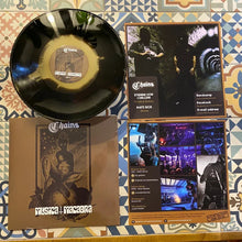 Cargar imagen en el visor de la galería, Vinyl record with cover and additional promotional materials on a patterned surface