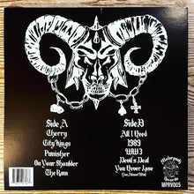 Cargar imagen en el visor de la galería, Vinyl record cover with ram's head design and track listing on a wooden surface
