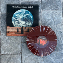 Cargar imagen en el visor de la galería, A vinyl record cover featuring a large planet in a starry sky with three figures in the foreground.