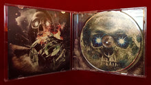 Load image into Gallery viewer, CD case with a skull design on a red background
