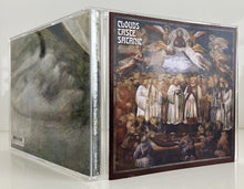 Cargar imagen en el visor de la galería, CD case with artistic cover featuring religious scene and text &#39;Clouds Taste Satanic&#39;.