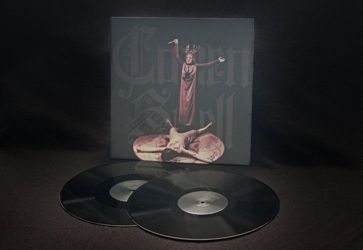 Vinyl record set with a cover featuring artistic design on a dark background