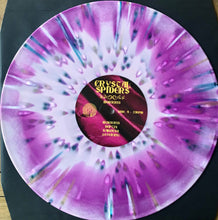 Load image into Gallery viewer, Vinyl record from the band Crystal Spiders with a colorful pink and purple design on a black background