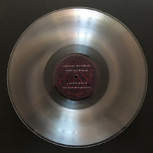 Charger l&#39;image dans la galerie, Clear vinyl record with a purple label on a black background