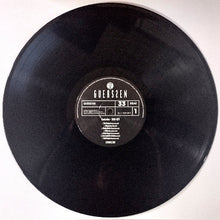 Charger l'image dans la galerie, Vinyl record with a visible label on a white background