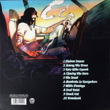 Charger l'image dans la galerie, Album cover with a person driving a car, featuring text on a black background