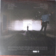 Load image into Gallery viewer, Album cover with a person standing in a tunnel, looking towards light