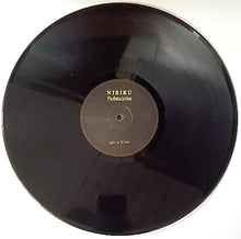 Charger l&#39;image dans la galerie, Vinyl record with &#39;NIBIRU&#39; label on a white background