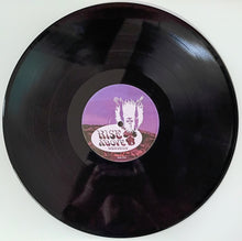 Cargar imagen en el visor de la galería, Vinyl record with a purple label on a white background
