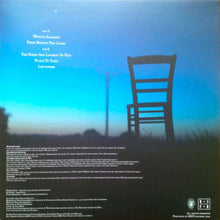 Cargar imagen en el visor de la galería, Silhouette of a chair against a blue sky with text on a record album cover.