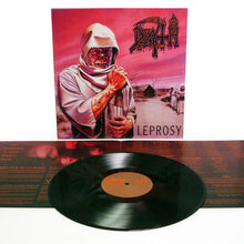 Cargar imagen en el visor de la galería, Vinyl record with 'Death' album cover featuring a person in a hooded outfit against a pink sky.