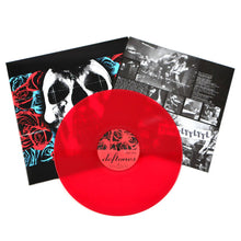 Cargar imagen en el visor de la galería, Red vinyl record with a black and white album cover and additional material on a white background