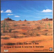 Load image into Gallery viewer, Desert landscape with cacti and text on a vinyl record cover