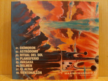 Charger l'image dans la galerie, Album cover with abstract art and text on a wooden surface