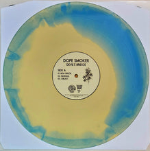 Load image into Gallery viewer, Vinyl record with a blue and yellow gradient and label on a white background