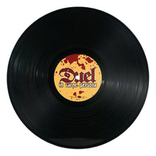 Cargar imagen en el visor de la galería, Vinyl record with a label featuring the text 'Duel in Carne Persона' on a white background