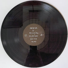 Cargar imagen en el visor de la galería, Vinyl record with a brown label on a white background